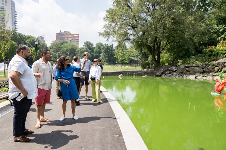 President Minouche Shafik with elected and city officials at Morningside Park Pond.