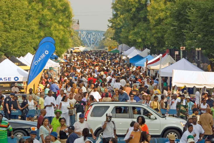 Vibrant music festival crowd enjoying performances at a music festival in the year 2022