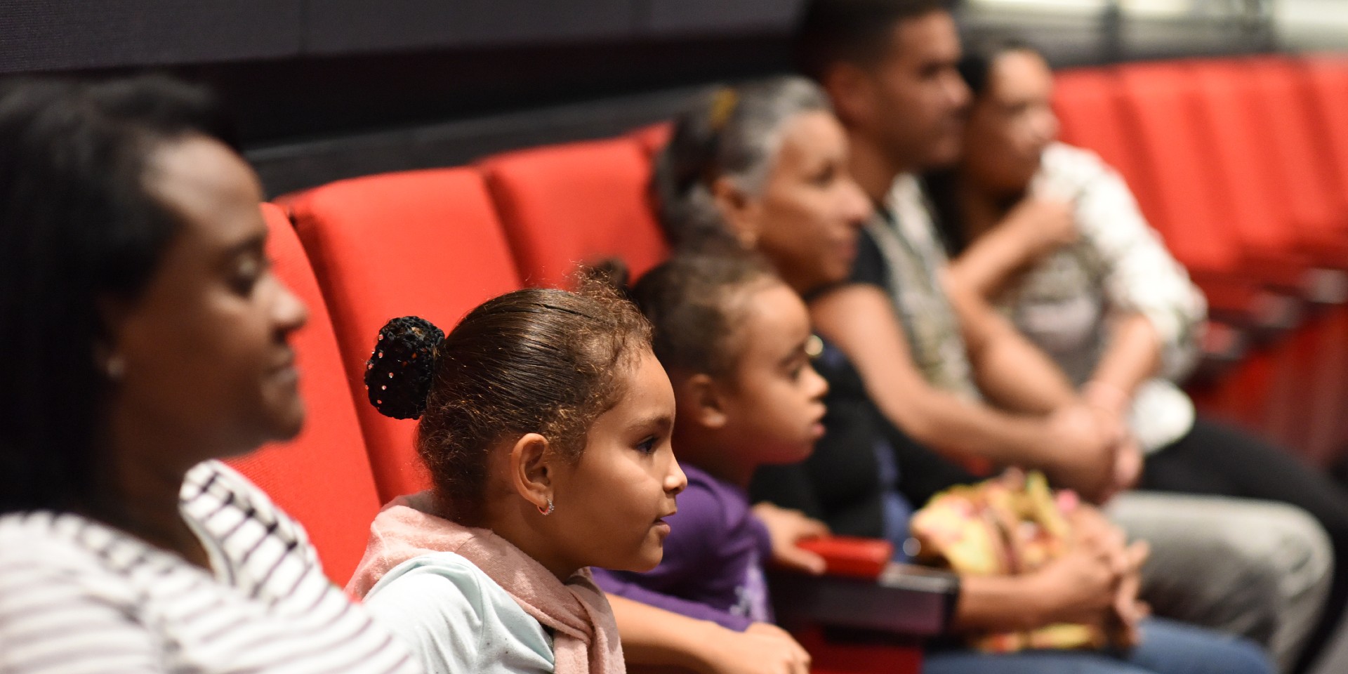 Children sitting in Lenfest theater. Photo Credit: Diane Bondareff