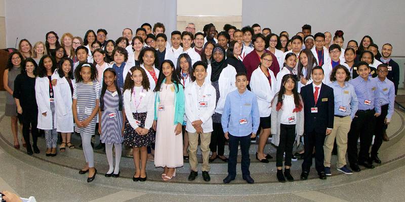 A large group of children and young adults who participated in the Lang Youth Medical Program.