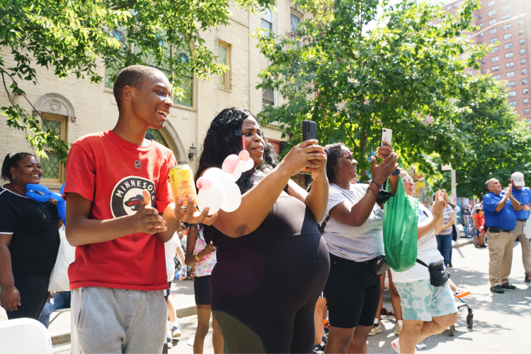 Attendees at the back-to-school event watching a dance competition. Photo Credit: Henry Danner Attendees at the West Harlem back-to-school event watching a dance competition. Photo Credit: Henry Danner