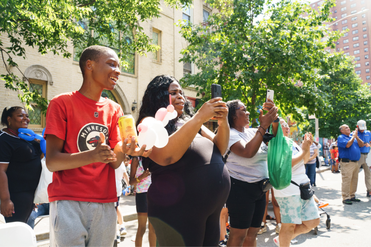 Attendees at the West Harlem back-to-school event watching a dance competition. Photo Credit: Henry Danner