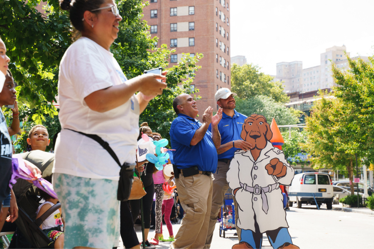 Public Safety officers Ricardo Morales and Amin Torres enjoying a dance competition at the West Harlem back-to-school event. Photo Credit: Henry Danner Public Safety officers Ricardo Morales and Amin Torres enjoying a dance competition at the West Harlem back-to-school event. Photo Credit: Henry Danner