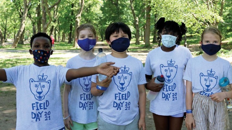 Children in the park with masks on