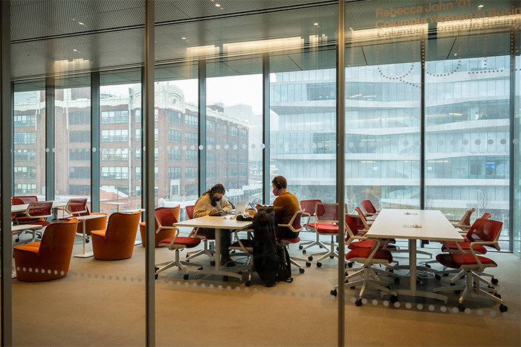 A glass-walled collaborative space in Columbia Business School. 