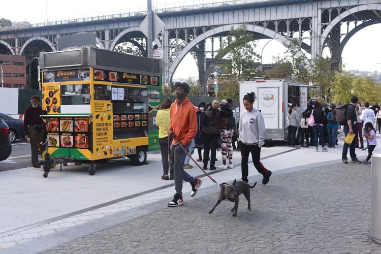 The iconic Harlem viaduct sets the backdrop for a day of fun at Community Day. Photo by Susan Farley. 