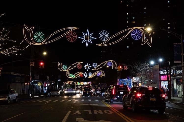 Festive holiday lights hanging on 125th Street in Harlem for the holiday season.