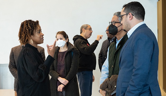 Managing Director at the Columbia-Harlem SBDC Kaaryn Nailor Simmons chats with Council Member Shaun Abreu and Blair Duncan, President and CEO, Upper Manhattan Empowerment Zone, in the lobby of David Geffen Hall at the start of the tour. 