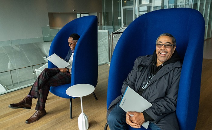 Assembly Member Al Taylor and Curtis Archer, President, Harlem Community Development Corp., relax in some of the new chairs in Kravis Hall. Photo by Diane Bondareff. 