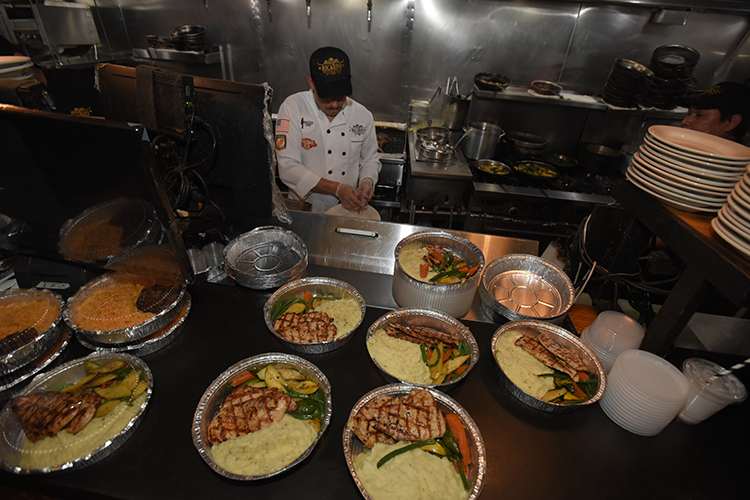 Delicious meals freshly prepared at Ricardo Steakhouse that were distributed to neighbors and community members. Image by Susan Farley. Prepared meals by Ricardo Steakhouse.