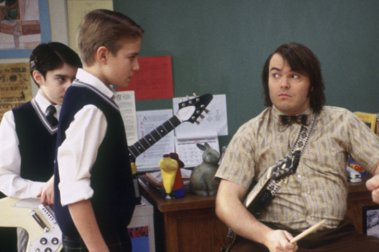 A teacher with a guitar and two kids with instruments.