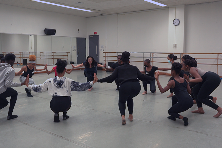 Sabrina Peck, center, coaches the connectivity needed to embody the witches in "Macbeth." Photo courtesy Sabrina Peck. Sabrina Peck (center) coaches the connectivity needed to embody the witches in Macbeth.