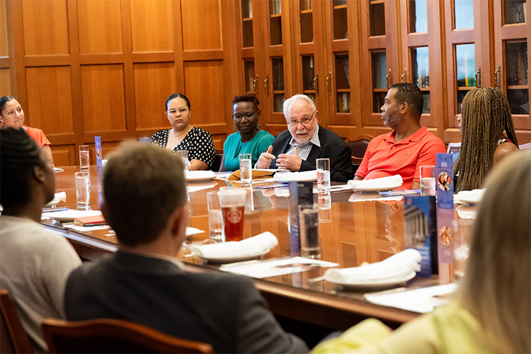 Double Discovery Center Founder Roger Lehecka speaks to a table of community leaders. 