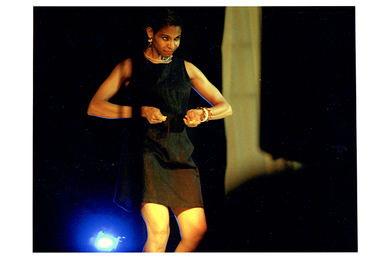 Josefina Báez, seen here performing for the first and only time in the Dominican Republic during its ten years season, her acclaimed piece "Dominicanish” in 2001. © Miguel Gomez