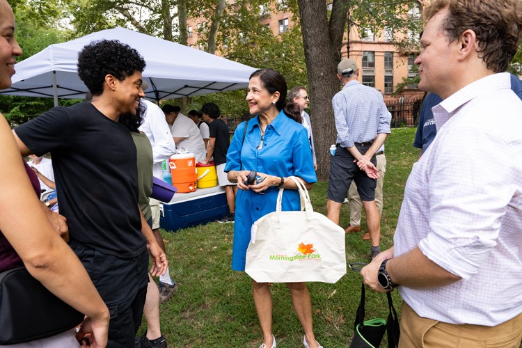 President Shafik meets community members at the announcement of the research partnership in Morningside Park. Photo credit: Diane Bondareff President Shafik with a group of community members.