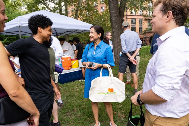 President Shafik with a group of community members.