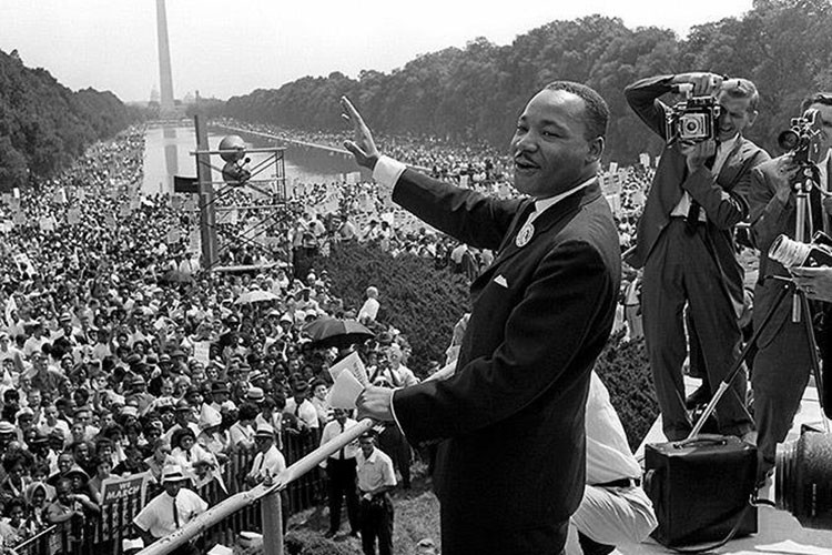 Martin Luther King Jr. giving a speech at the Washington Monument.