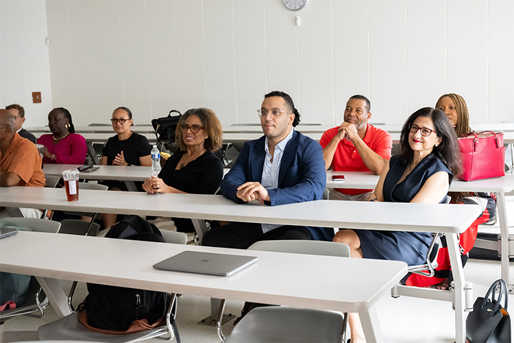 Community, elected, and Columbia leaders observe a Double Discovery Center classroom session.