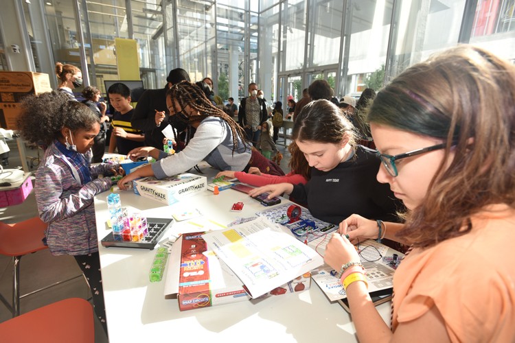 Kids doing fun science activitist on Community Day. 