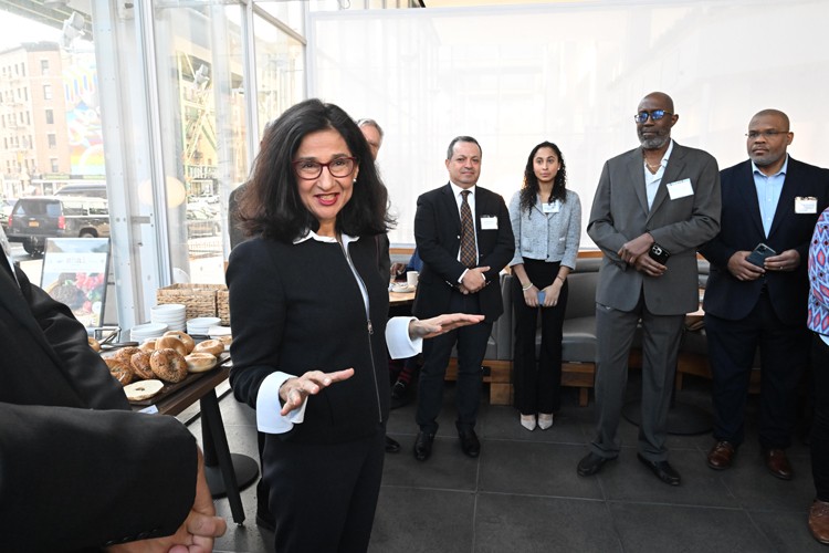 President Shafik stands and delivers remarks at The Forum in Manhattanville to a crowd of community leaders in January 2023.