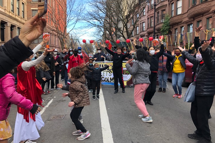 Kids dancing in a UMAAA block party. 