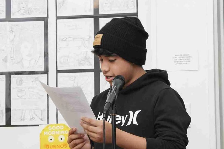 Child reading a poem.