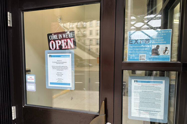 Entrance of the Columbia Employment Information Center. Photo credit: Columbia Neighbors Entrance to the Columbia Employment Information Center with a welcome sign and three posters plastered on the glass windows.