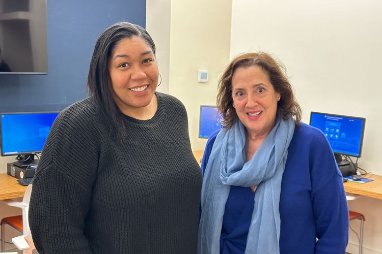 Elizabeth Jones, director of Community Employment Programs and Services (left) and Barbara Catalano, executive director of CUEI (right). Photo credit: Columbia Neighbors Two female employees of the Columbia Employment Information Center standing in the computer lab.