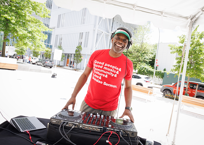 DJ Stormin' Norman brings the tunes to Manhattanville Community Day. Photo by Sirin Samman. DJ Stormin Norman at Community Day
