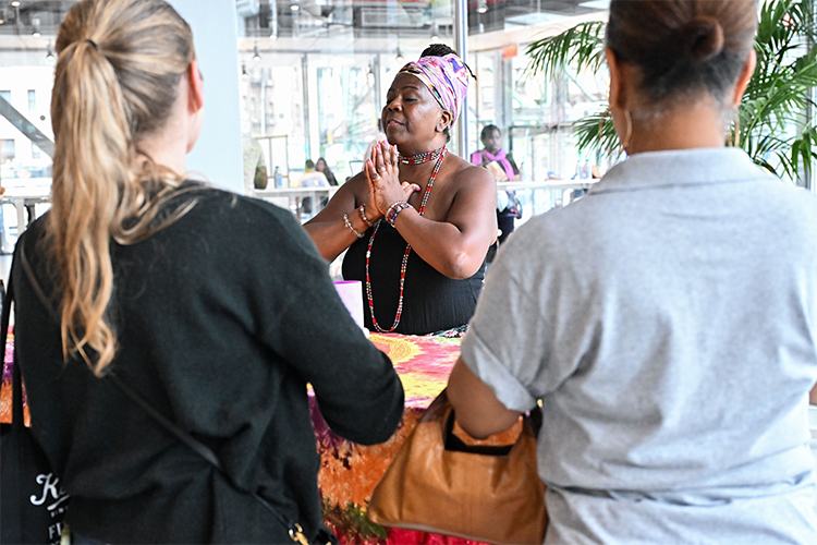 "Breathe Beautifully with Goddess Salaam" hosted active meditation and a sound bath throughout the afternoon, bringing calm and reflection to Manhattanville Community Day participants. Photo by Diane Bondareff. Two attendees engage in meditation at Manhattanville Community Day.