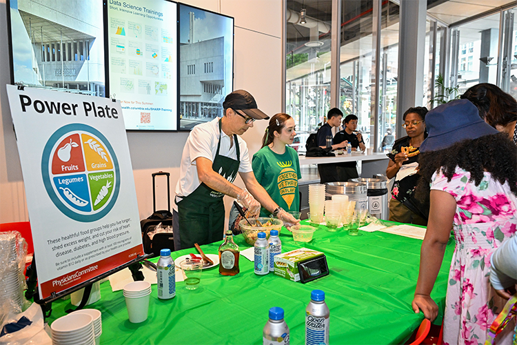 Luis Moral, a Food For Life Instructor with the Physicians Committee For Responsible Medicine, shares information about plant-based foods. Photo by Diane Bondareff. Luis Moral shares information about plant-based foods