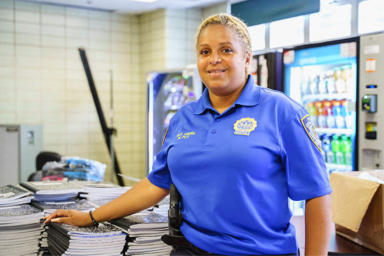 Detective Johanna Ureña of the 26th Precinct’s Community Affairs unit has been on the force for over 20 years. She oversees the school supply drive and the back-to school event where the supplies are distributed. Photo Credit: Henry Danner Detective Johanna Ureña of the 26th Precinct’s Community Affairs unit has been on the force for over 20 years. She oversees the school supply drive and the back-to school event where the supplies are distributed. Photo Credit: Henry Danner