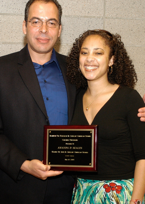 Photo courtesy of Amanda Seales Amanda Seales with man holding plaque