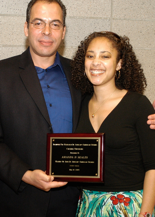 Amanda Seales with man holding plaque