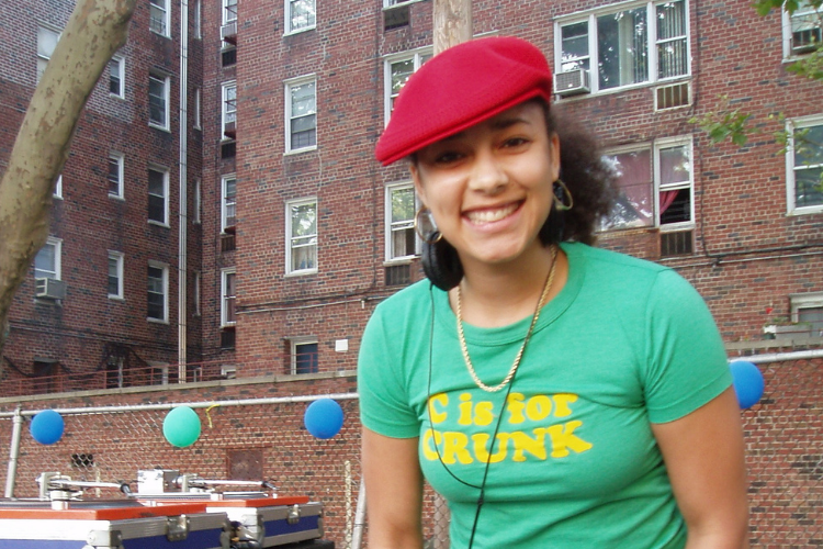 Photo courtesy of Amanda Seales Amanda Seales in green t-shirt and red cap