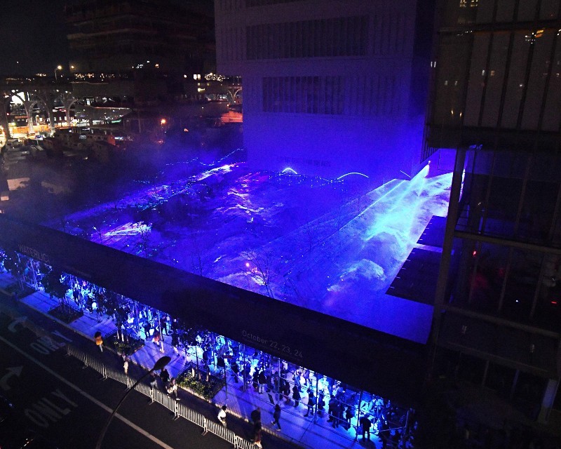 Aerial view of WATERLICHT, blue and white LED lights depicting sea water levels.