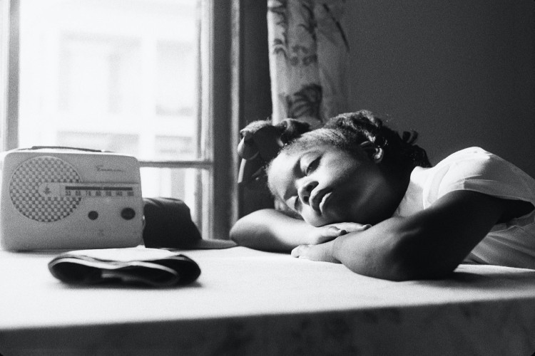Little girl laying down on table