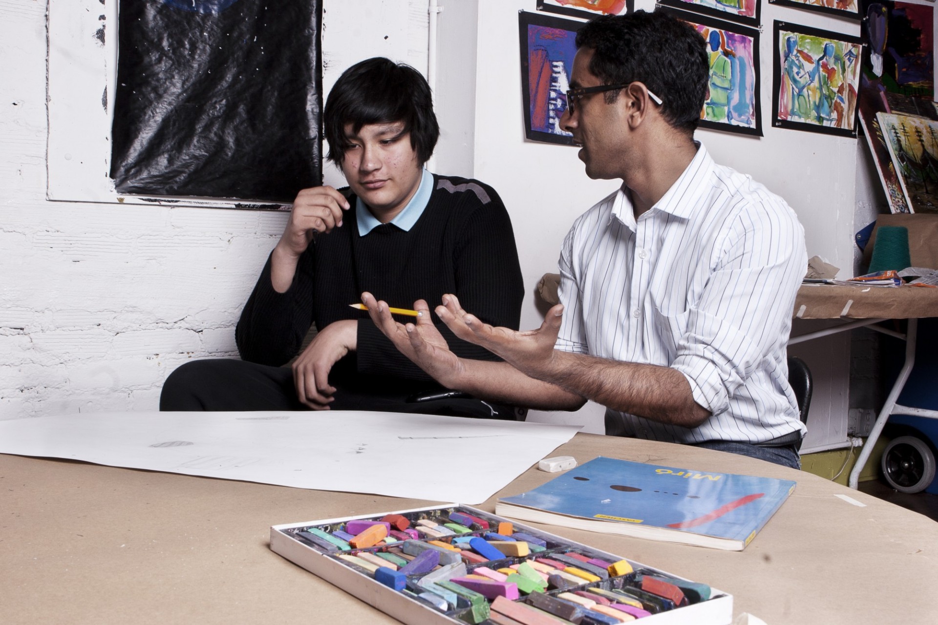 Adarsh Alphons teaches art concepts to local area youth.