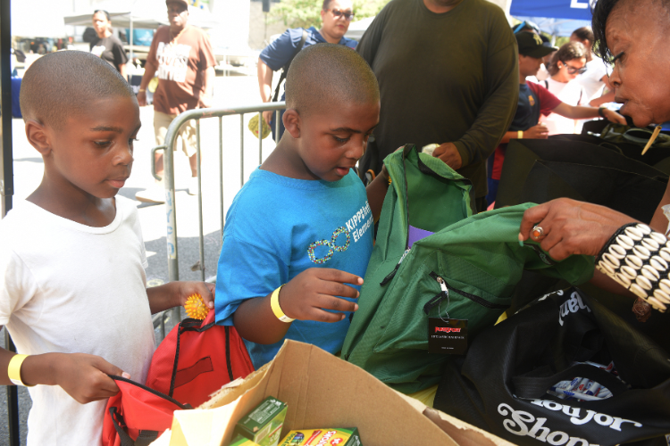 Local youth received backpacks packed with school supplies at the back-to-school block party. Photo credit: Susan Farley. Local youth received backpacks packed with school supplies at the back-to-school block party. Photo credit: Susan Farley