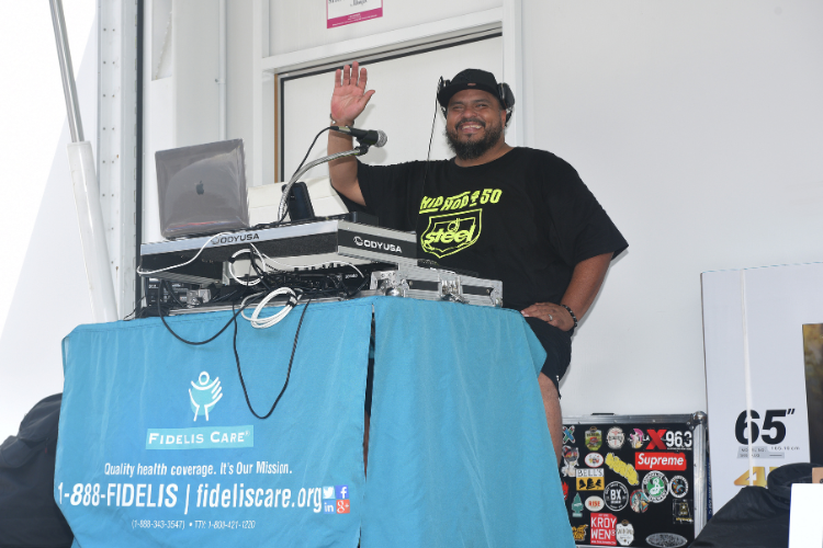 Upbeat music spun by a local DJ kept the celebratory vibes going at the back-to-school block party. Photo credit: Susan Farley. Upbeat music spun by a local DJ kept the celebratory vibes going at the back-to-school block party. Photo credit: Susan Farley