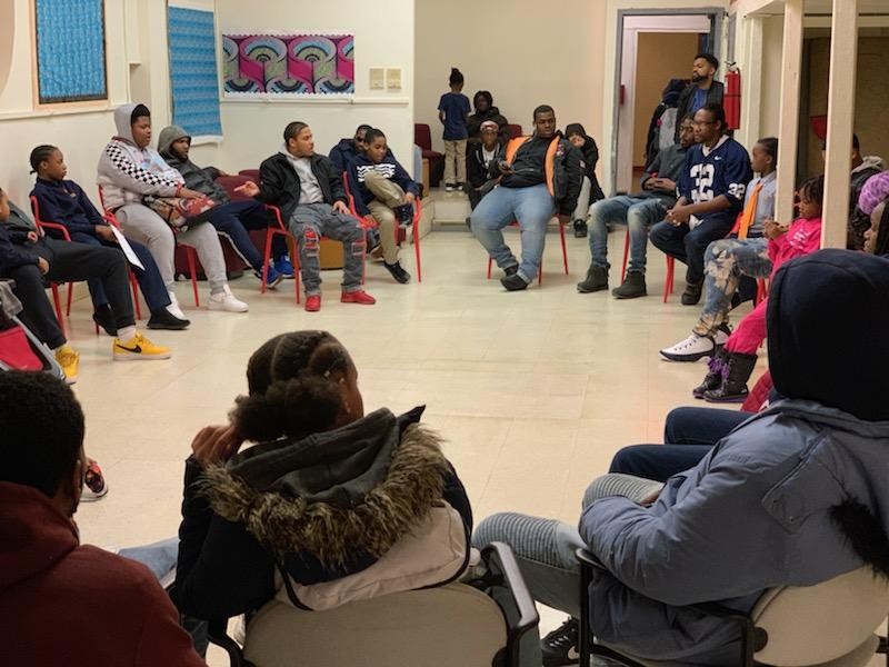 Program members participate in a narrative therapy session led by one of LRYOH’s credible messengers mentors, Jason Davis