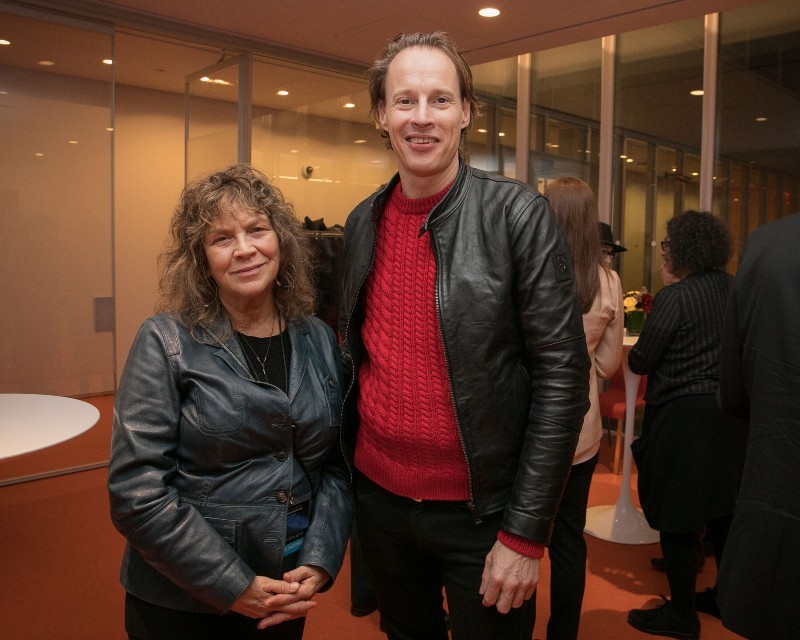 Carol Becker, Dean of the School of the Arts and Daan Roosegaarde, Dutch artist at the WATERLICHT reception. Photo Credit: Sirin Samman Carol Becker and Daan Roosegaarde posing for a picture at a reception.