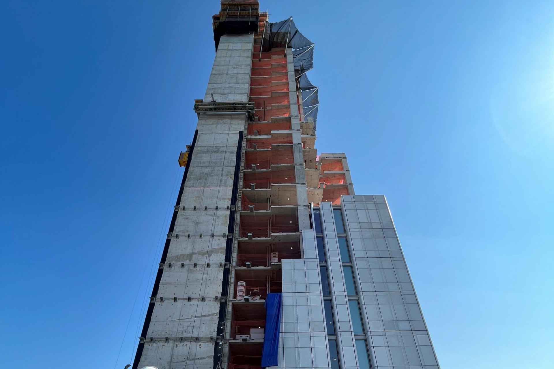 A view of the 600 W. 125th Street construction site which is 33 floors high, and has some facade panels installed around it. 