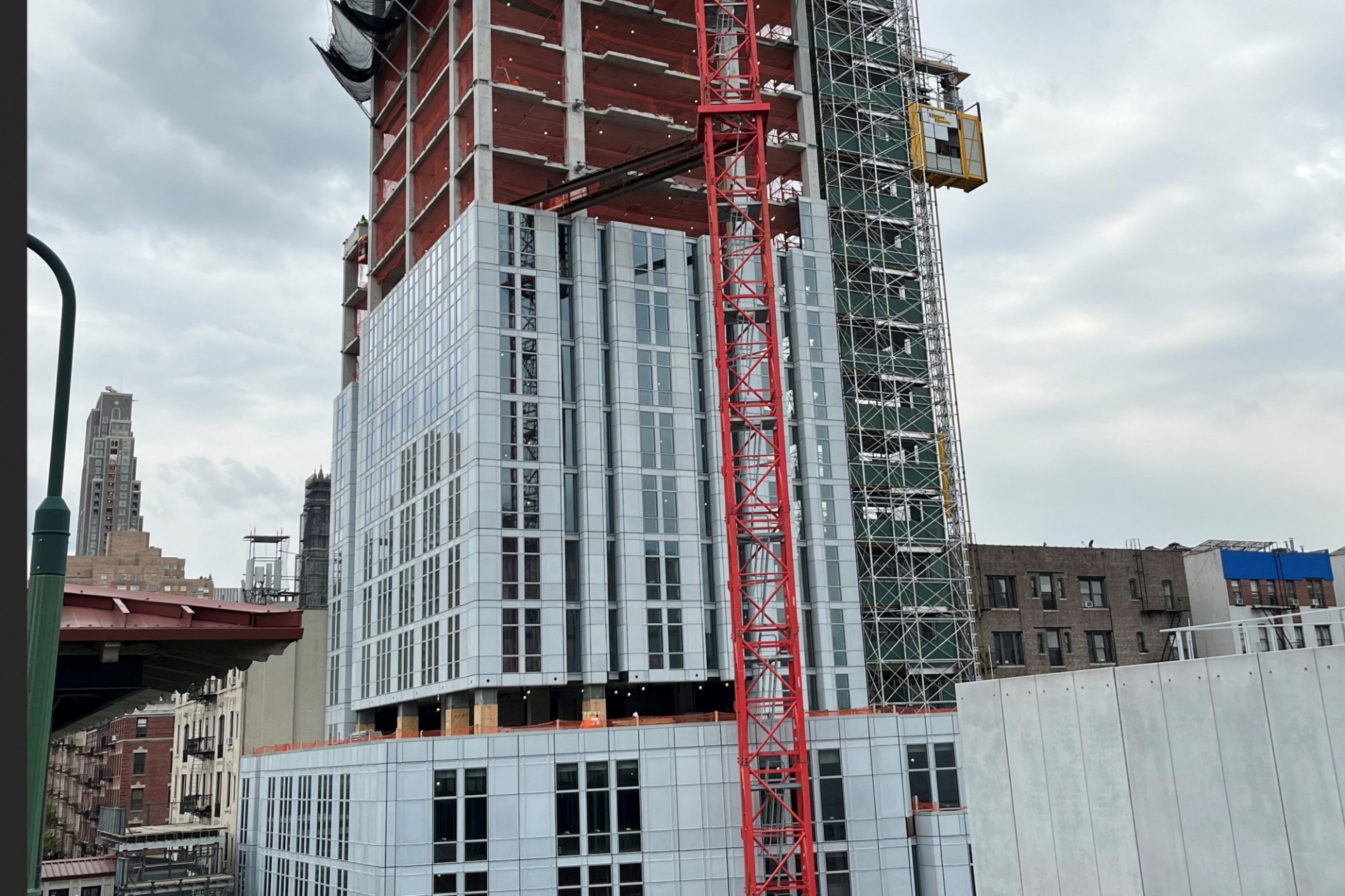 A view of the 600 W. 125th Street construction site which is 28 floors high, and has some facade panels installed around it. 