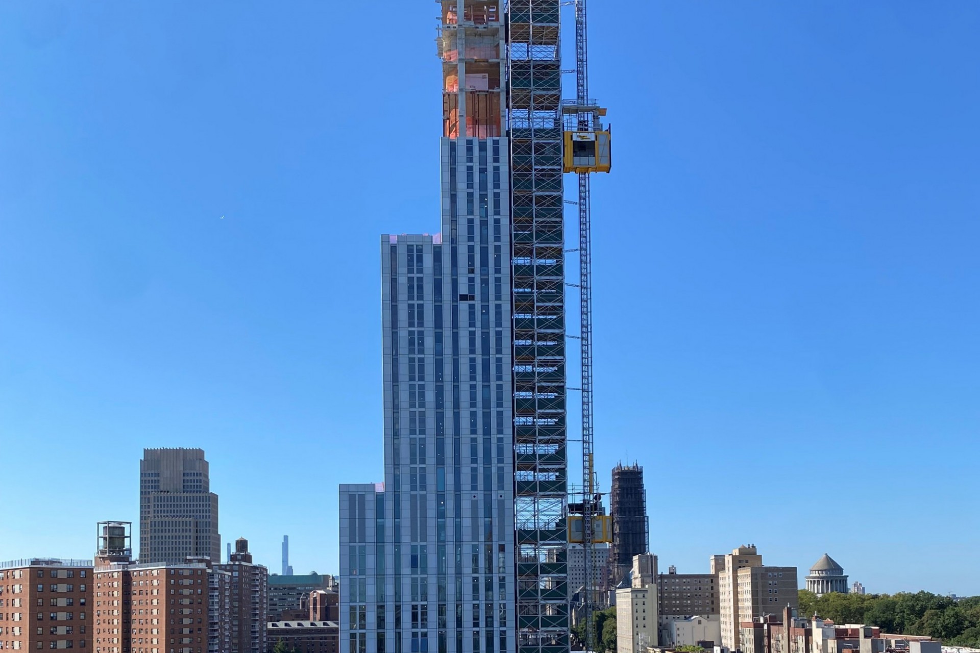 A view of the top floors of 600 W. 125th Street with the Upper West Side in the background.