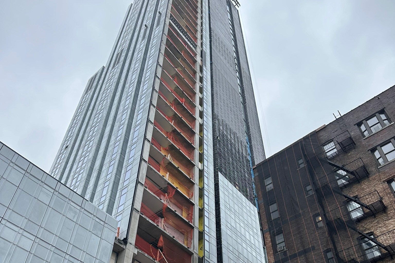 A view of the 600 W. 125th Street from the street level, looking up to the upper floors.  