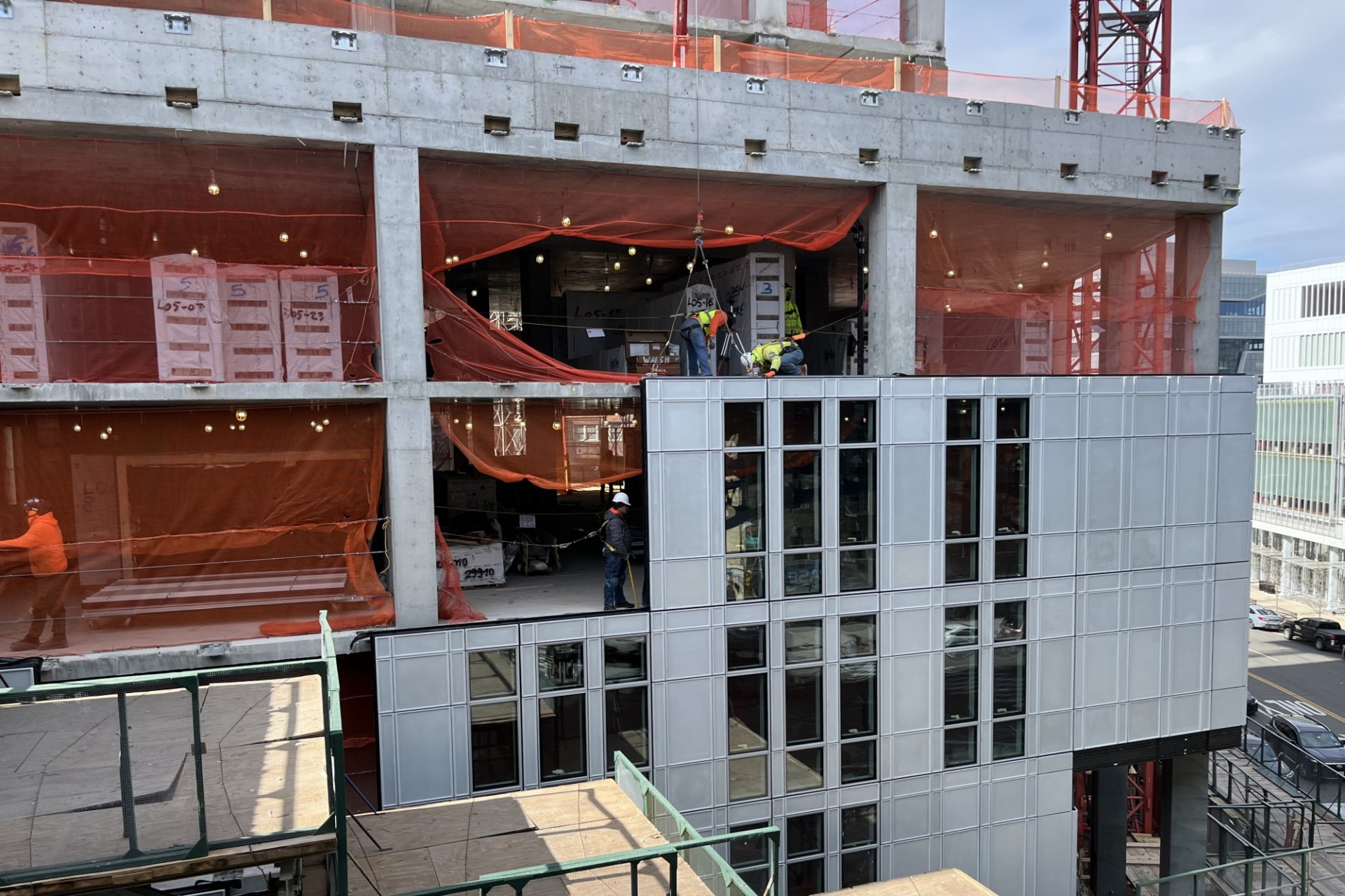 600 W. 125th Street, looking west Exterior panels are being installed around the lower floors of the building.