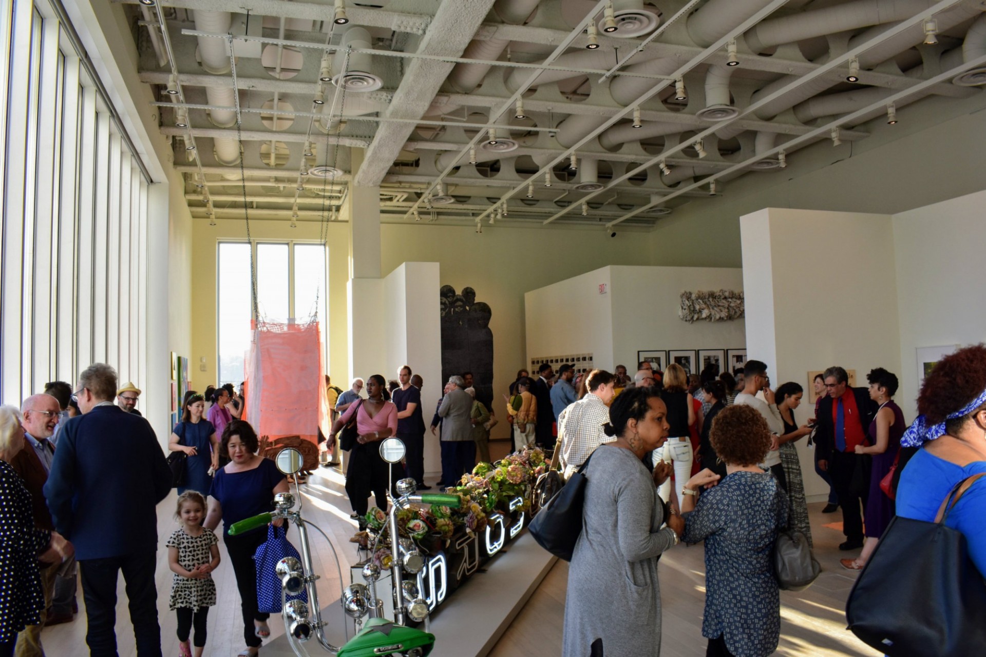Visitors explore the Uptown exhibit.