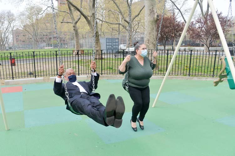 Man and woman on swingset