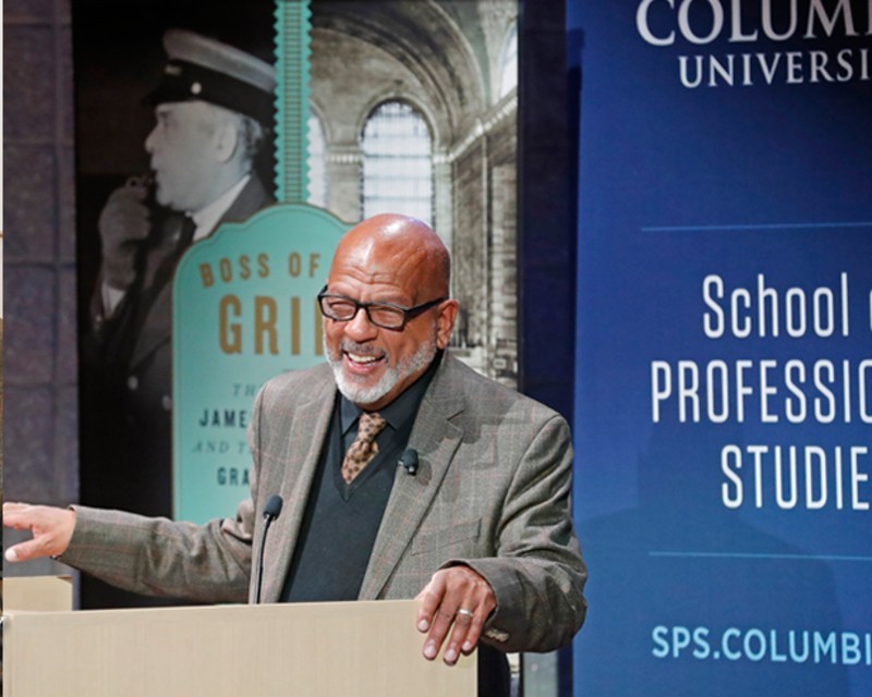 Eric K. Washington discussing his debut biography "Boss of the Grips" at the SPS lecture series, Photo Credit: Lou Rocco Eric K. Washington at podium discussing his book "Boss of the Grips"